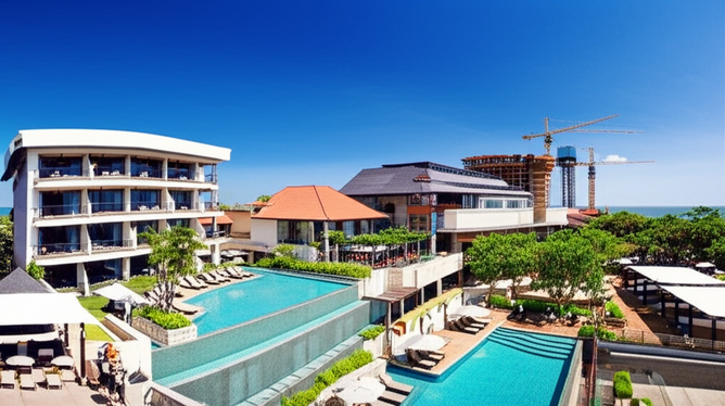 A photograph depicting the diverse commercial buildings in Bali, showcasing the island's economic prosperity through its tourism sector.