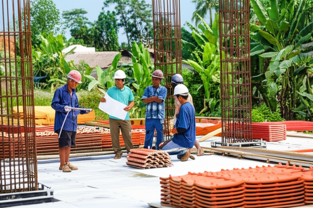 Construction site in Bali showcasing quality assurance and risk management practices, including waterproofing, material inspections, and project management.