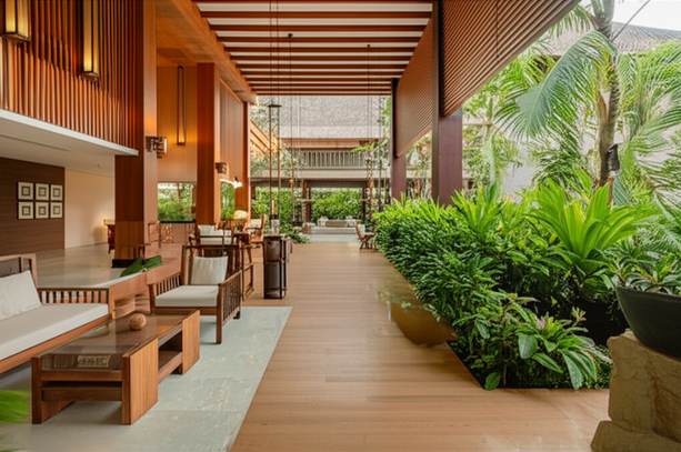 Modern Balinese hotel lobby featuring a seamless blend of indoor and outdoor spaces, showcasing natural materials and luxurious design.