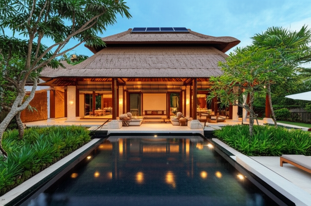 Architectural visualization of a luxury Bali villa showcasing Balinese design principles with open-plan living, thatched roof, and sustainable features.