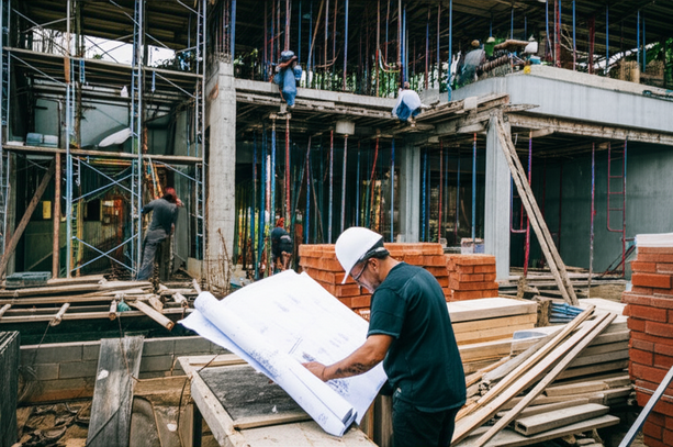 Construction of a Bali villa with a project manager overseeing the build.