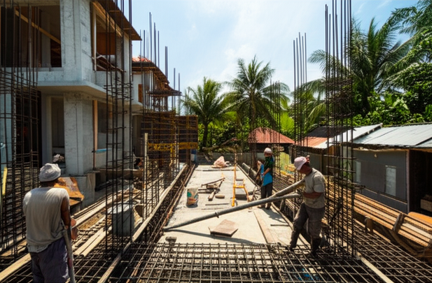 Image depicting various stages of Bali villa construction, highlighting foundation work, structural framing, and quality control measures.