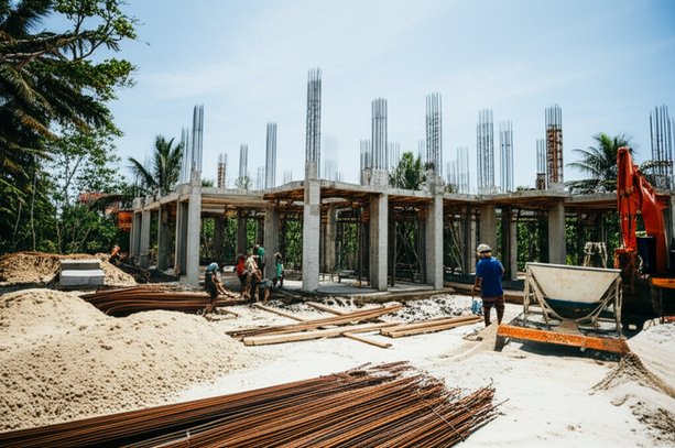 Image illustrating the various stages of villa construction in Bali, showing site preparation, structural work, and the tropical environment.