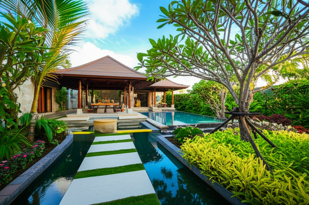 Beautiful Bali villa with a landscaped garden, infinity pool, and outdoor living area.