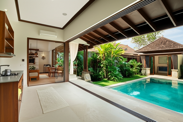 A renovated Bali villa with a modern kitchen, luxurious bathroom, and a seamless indoor-outdoor living experience with a private pool and garden.