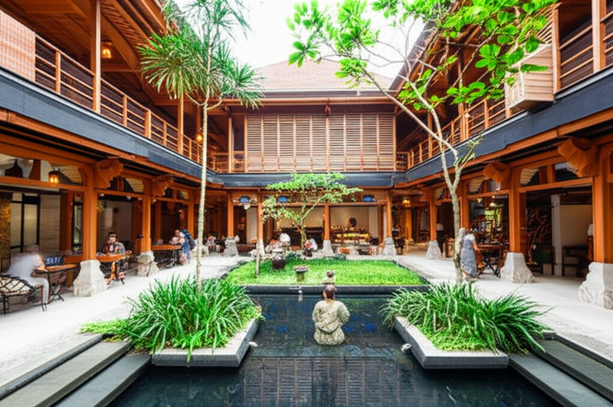 A modern commercial building in Bali, designed to integrate with nature and Balinese principles.