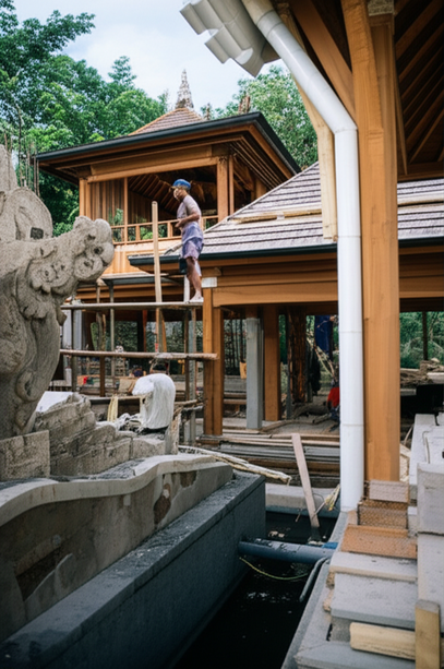 Balinese villa under construction, showcasing traditional craftsmanship and modern building techniques.