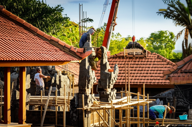 Construction of a Balinese villa, showing local and imported materials being used by skilled artisans.