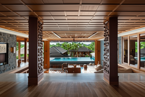 A luxurious Balinese villa showcasing high-end construction with traditional and modern elements.