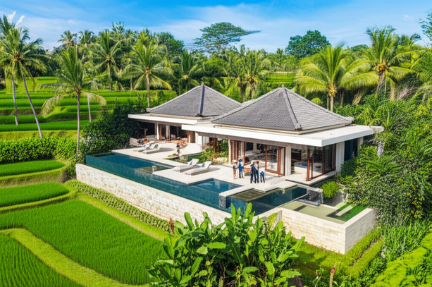 Architectural rendering of a modern Balinese villa showcasing open-air living spaces, a swimming pool, and natural materials, blending with the lush tropical landscape.