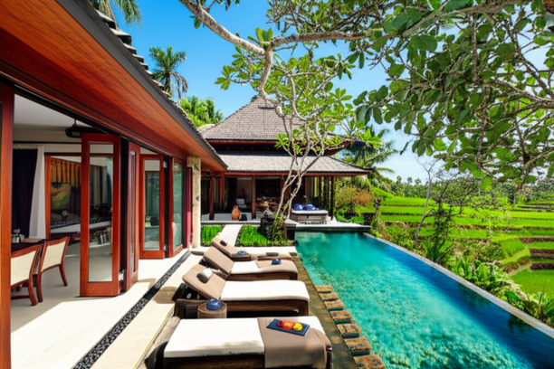 Luxurious Balinese villa with open-air design, blending modern comfort with traditional aesthetics.