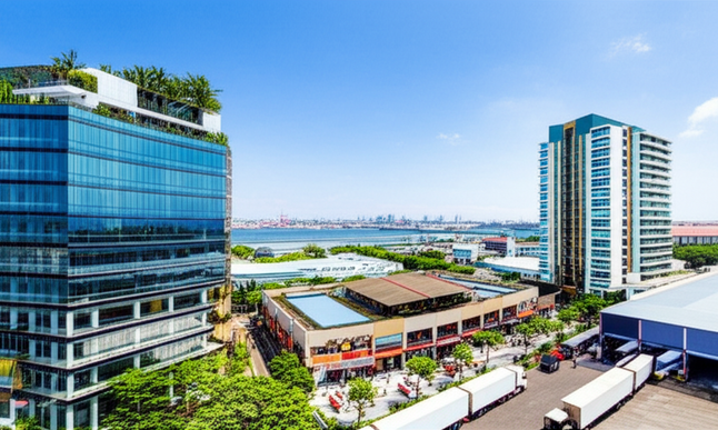 A diverse scene of commercial buildings in Bali, including office buildings, retail complexes, industrial warehouses, and multi-family apartments.