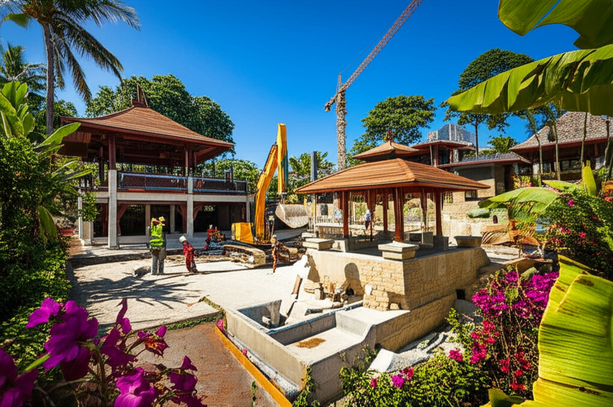 Construction site of a modern villa in Bali with traditional Balinese architecture, showcasing general contractor oversight and integration of the building with the tropical landscape.