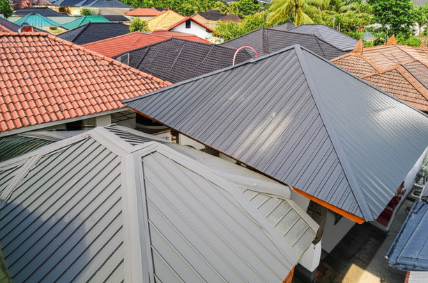 Illustration of various modern roofing materials like asphalt shingles, metal roofing, concrete tiles, and synthetic thatch suitable for Bali's tropical climate.