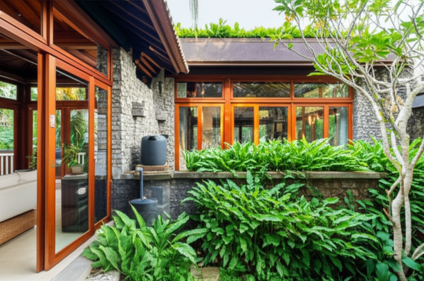 A beautifully renovated Balinese villa showcasing sustainable design practices, with natural light, local materials, and integrated rainwater harvesting.