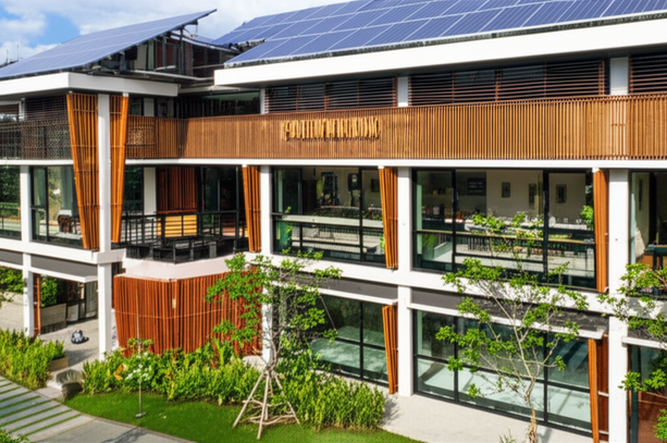 A rendering of a sustainable commercial building in Bali, featuring modern design, green elements, and Balinese architectural influences.