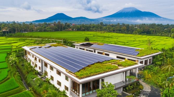 An illustration of a modern, eco-friendly industrial facility in Bali, showcasing sustainable design and integration with the environment.