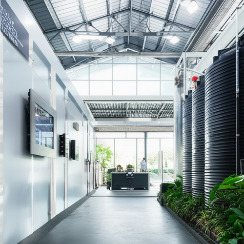An illustration of a sustainably renovated industrial facility in Bali, showcasing energy efficiency and water conservation practices.